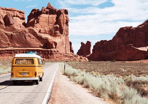 Van driving off into the sunset through the desert southwest represent a fulfilling retirement