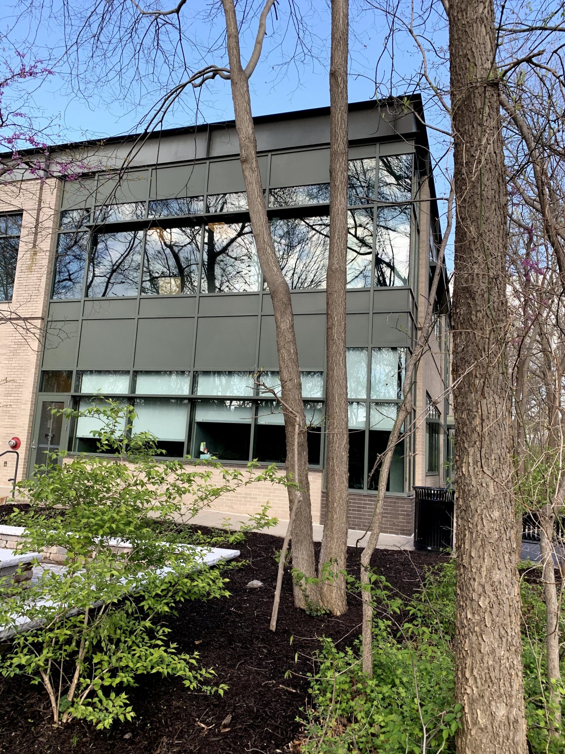 The exterior of the modern brick and glass building housing the Three Streams Financial office, where Daniel Gould practices as a financial advisor in Overland Park, KS.